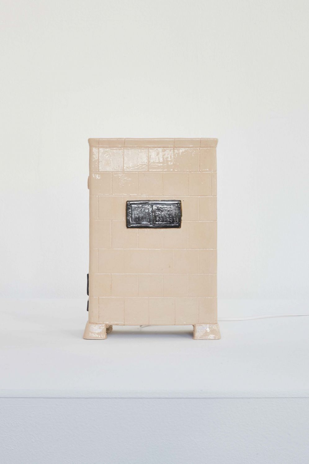 *Shira*, Glazed ceramic, electrical wiring and heating film, 32 × 23 × 9 cm, 2020