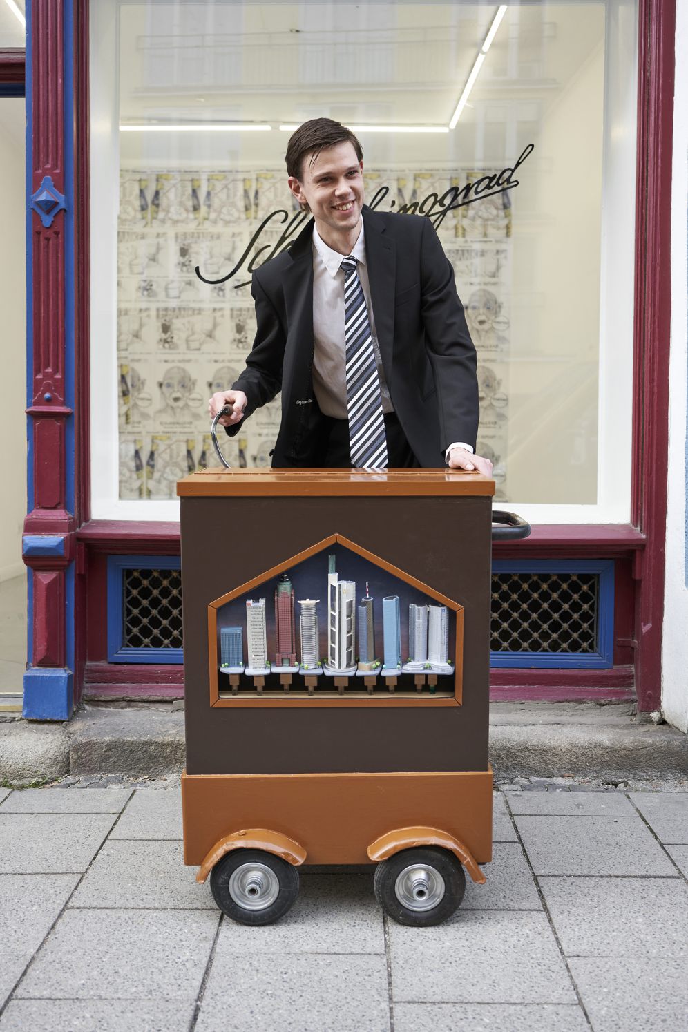 Skyline Organ (Frankfurz), 2021, customized barrel organ, brass pipes covered with architectural models made from cardboard, aluminum foil and acrylic paint, customized punchcard „Wind of Change“, 100 x 80 x 60cm